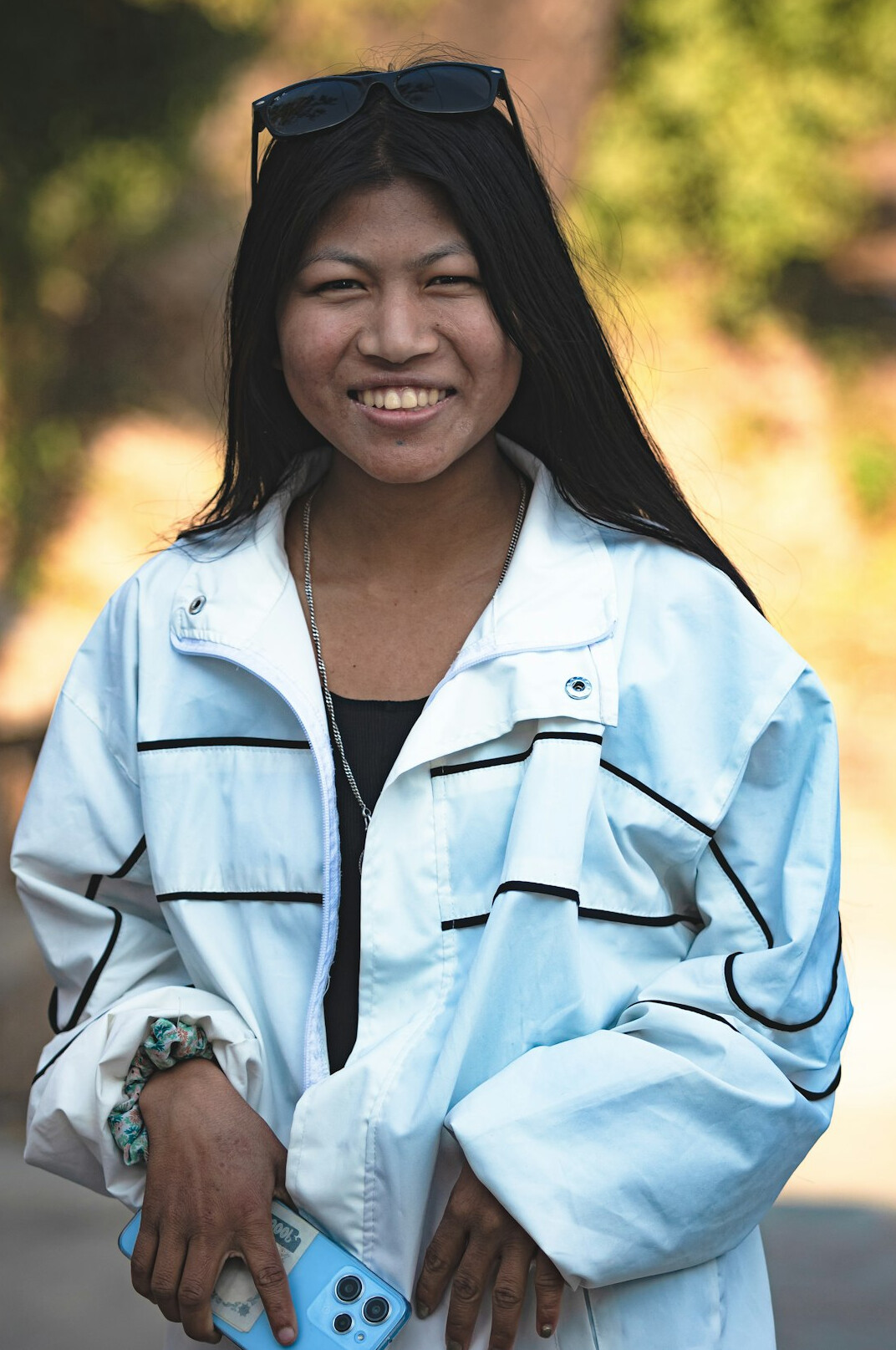 Malaysian engineering advisor wearing a headset and smiling