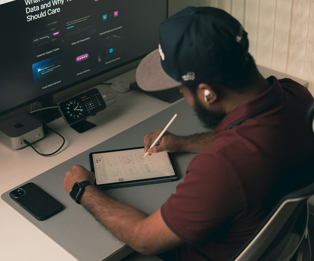 employee writing code at desk