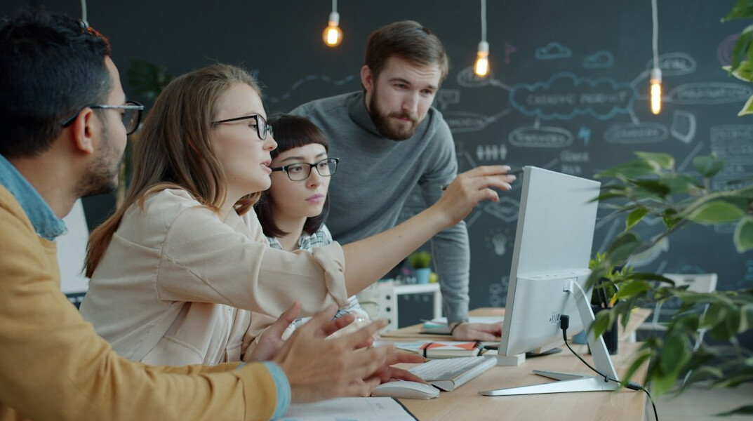 corporate team reviewing code