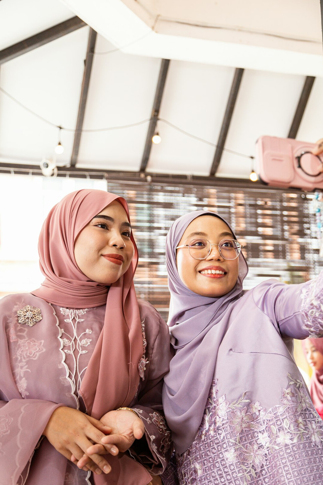 Diverse Malaysian software engineering team reviewing code together